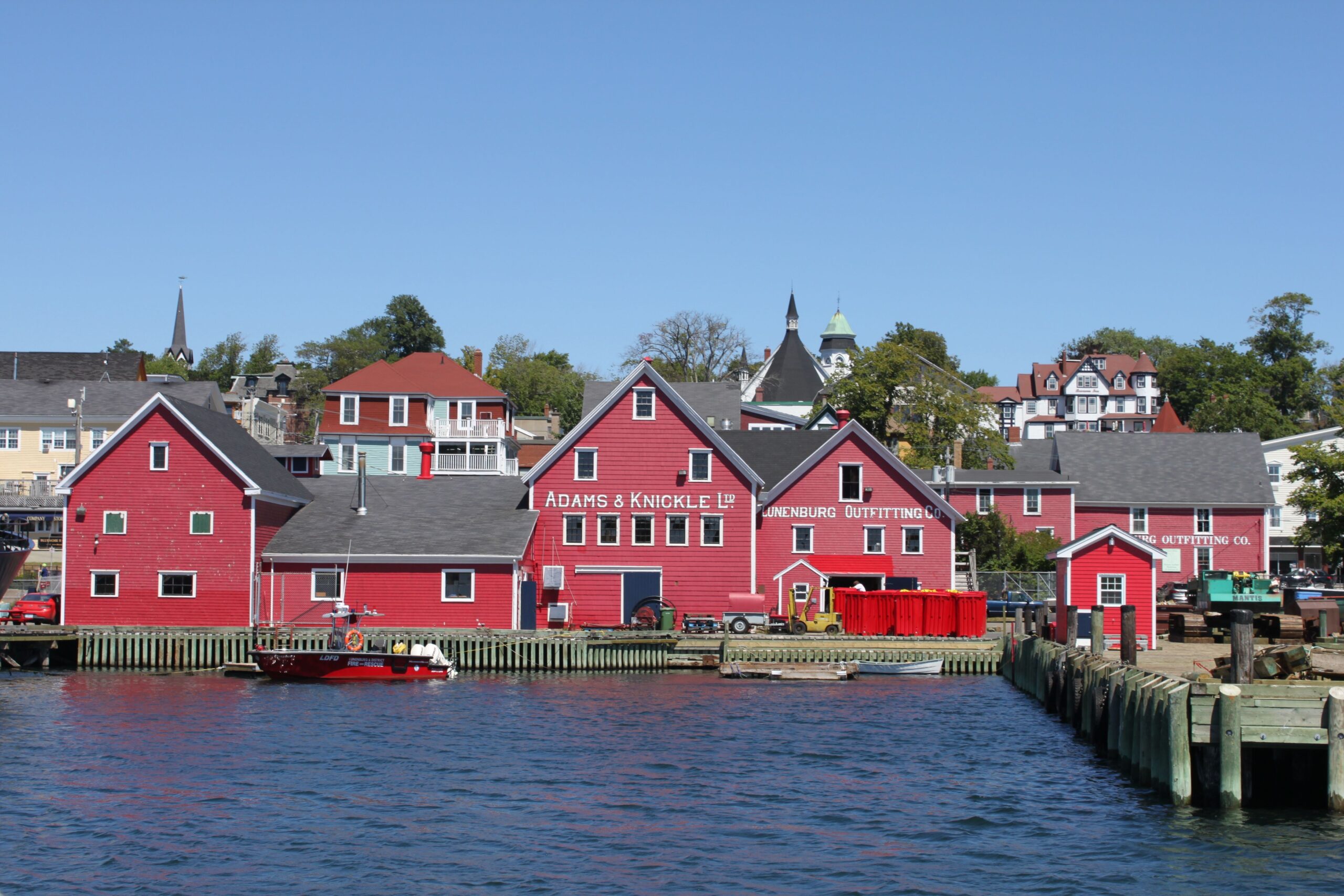 Colorful waterfront buildings in Lunenburg, Nova Scotia, served by Lunenburg to Halifax Airport Taxi.